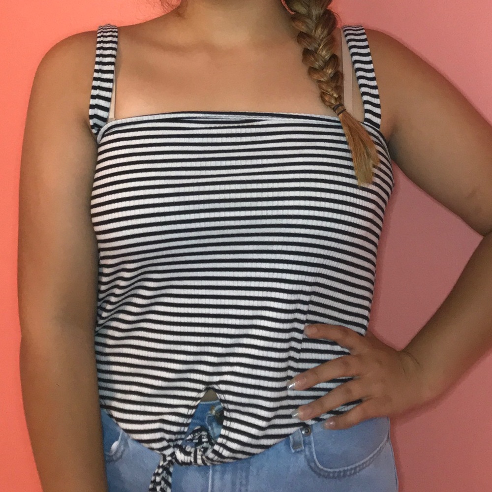 white and black top with tie in front